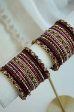 Hina maroon, wine, and dusty pink velvet stacked bangle set with red and champagne stone bangles in antique gold tone