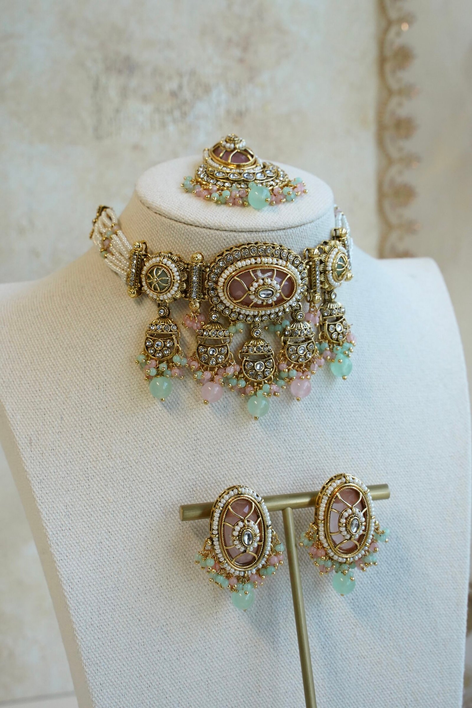 Ameera artificial kundan choker set in pastel mint and pink with earrings and tikka