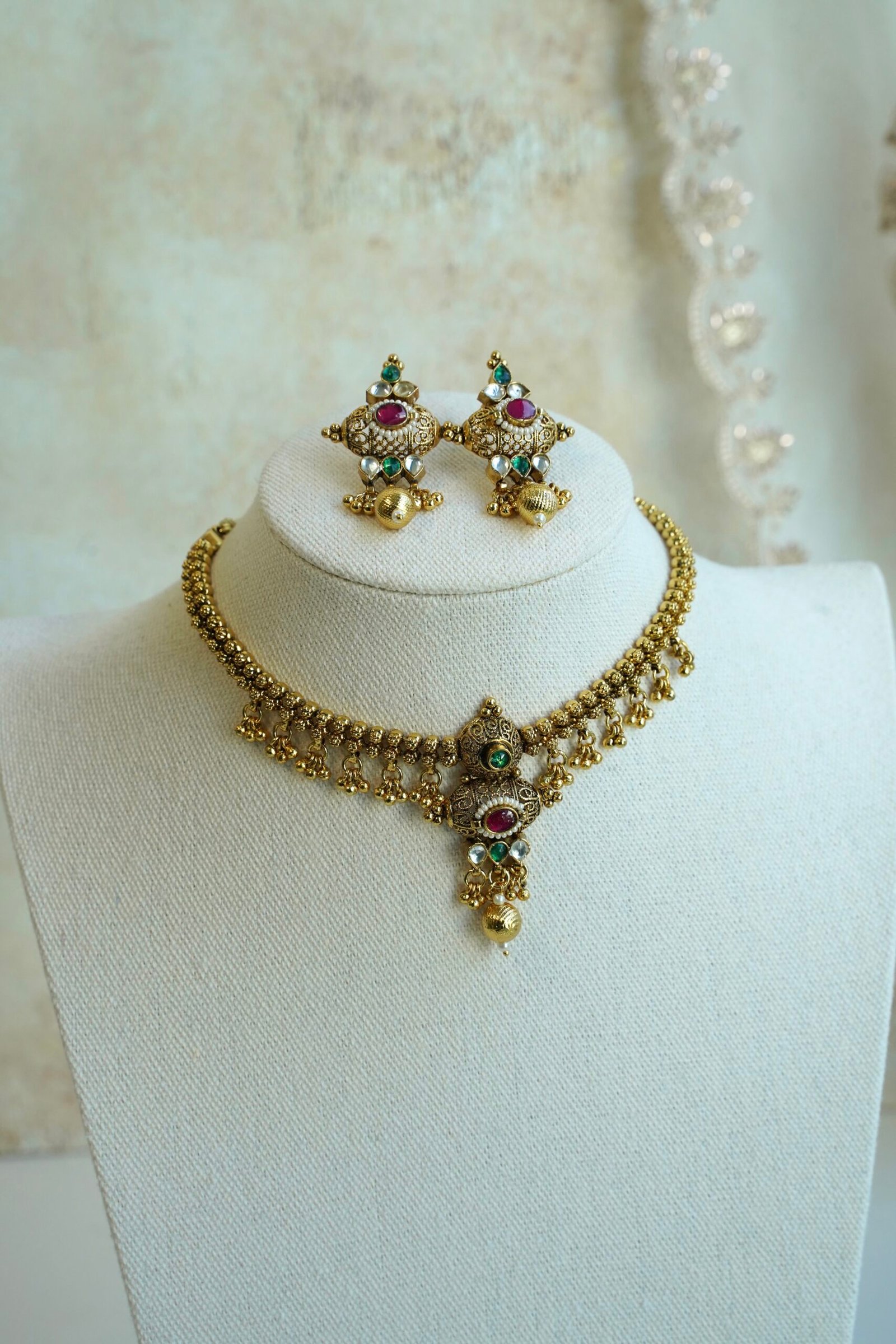 Padmini ruby green necklace set in antique gold tone with adjustable necklace and matching earrings