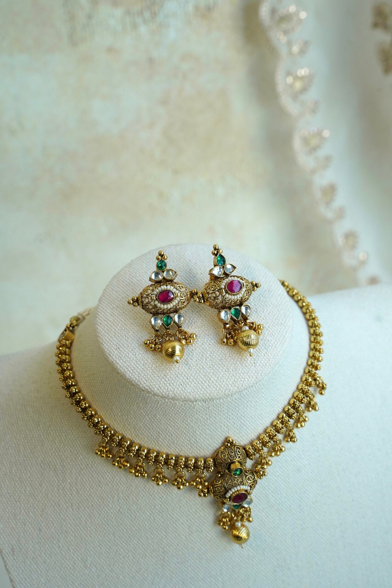 Padmini ruby green necklace set in antique gold tone with adjustable necklace and matching earrings