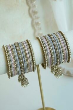 Pastel blush pink and dove gray stacked bangle set with beaded edges, champagne teardrop stones, and hanging jhumka charms