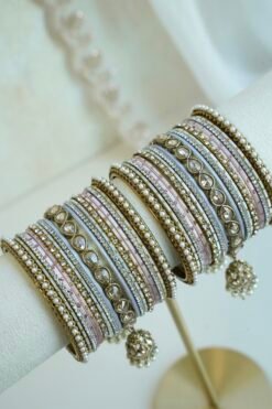 Pastel blush pink and dove gray stacked bangle set with beaded edges, champagne teardrop stones, and hanging jhumka charms