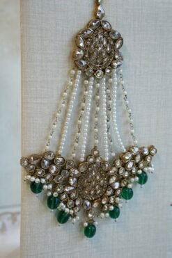 Zeenat green bridal set with layered choker necklace, jhumar, jhumka earrings, and tikka in antique gold tone