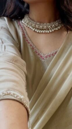 Zoya necklace set in with clear stones, hanging light green beads, matching earrings, and tikka